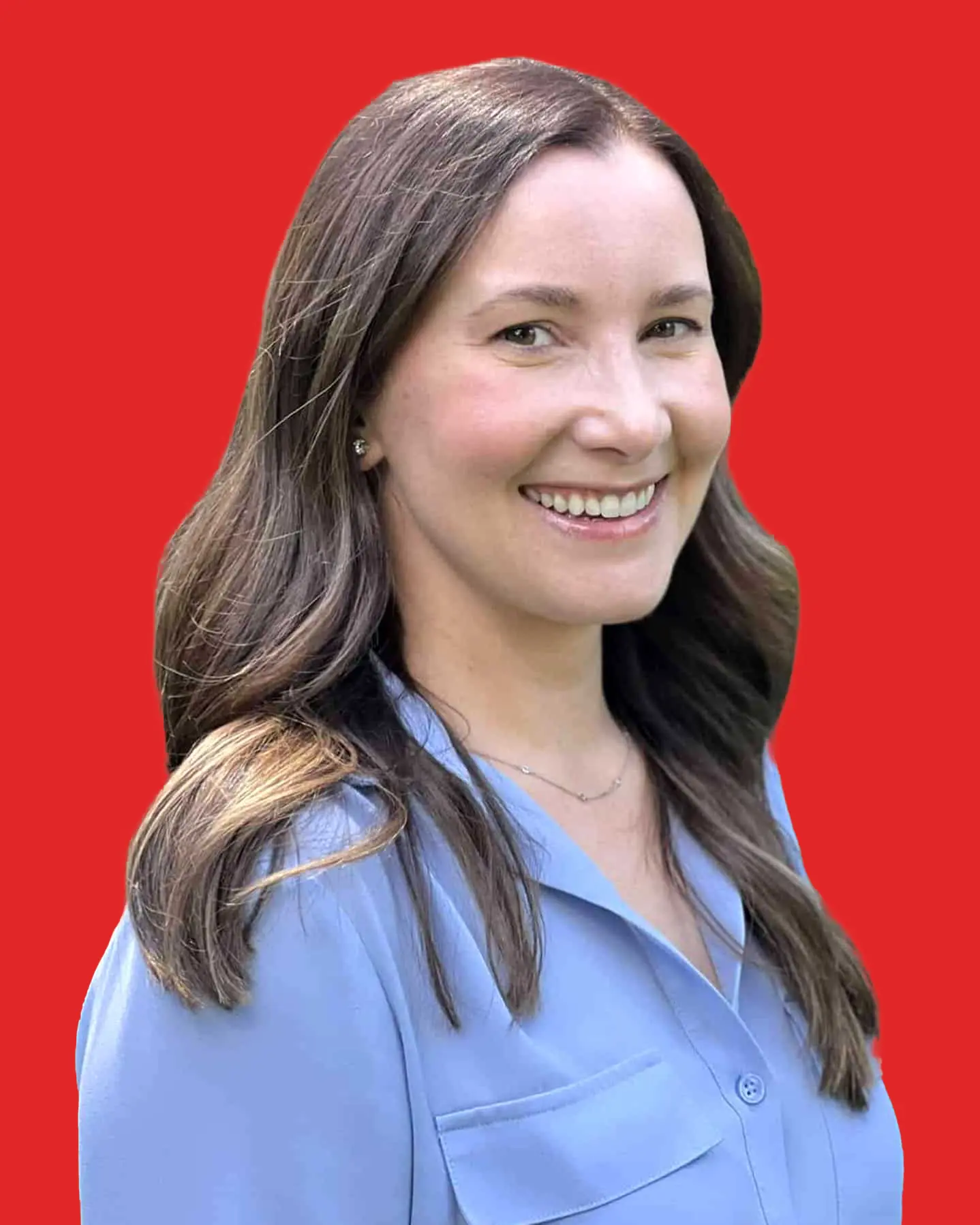 Smiling woman in blue shirt, red background